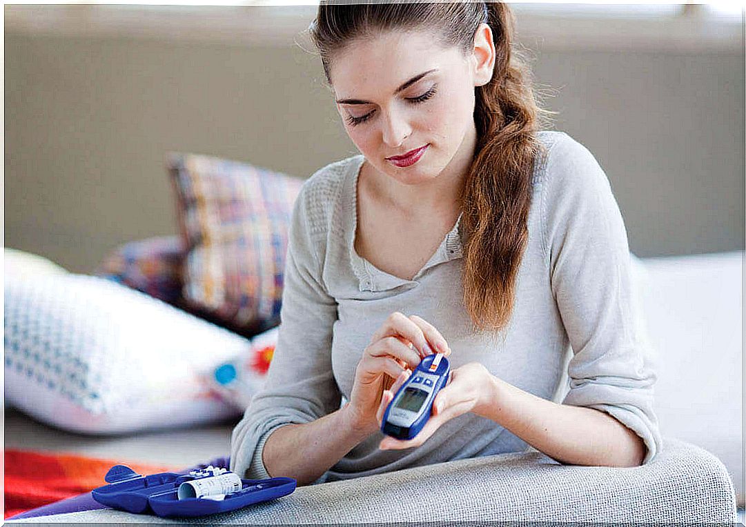 woman testing her blood sugar