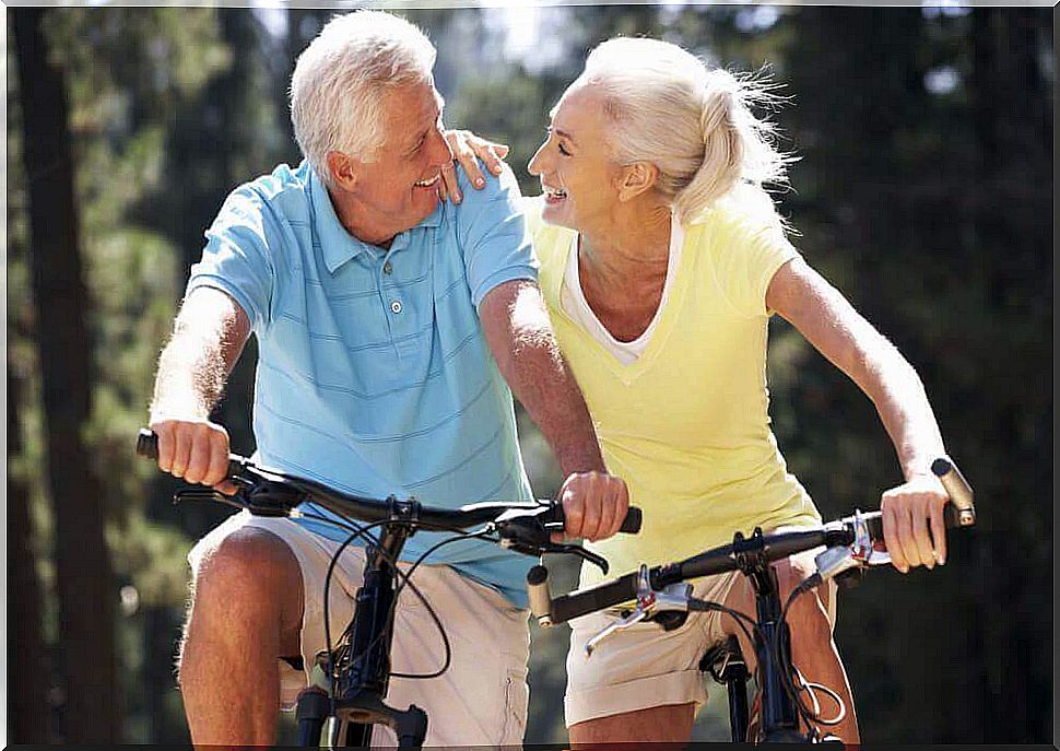 elderly couple cycling