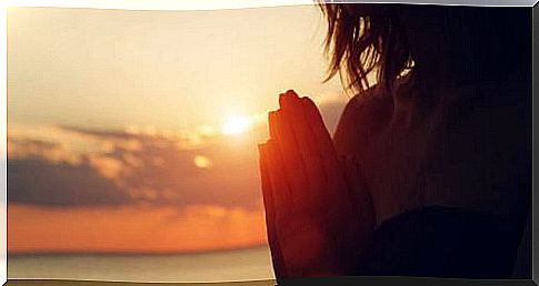 woman meditating in the evening sun