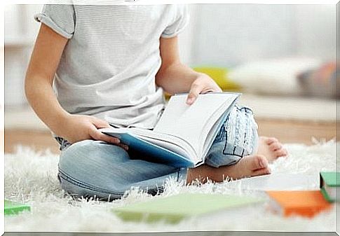 boy reading on the floor